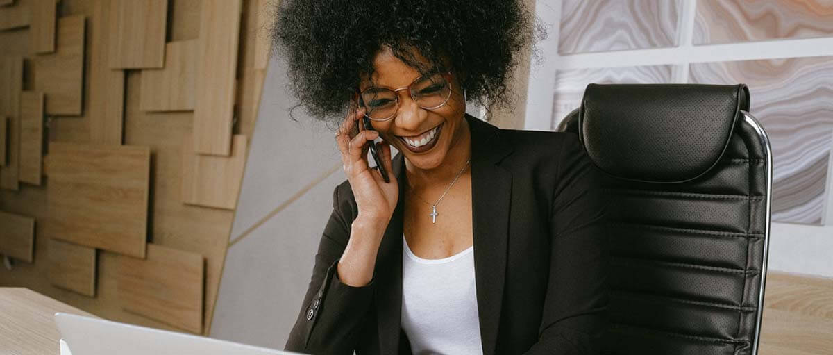 Photo of a happy small business owner offering an alternative health benefit to employees